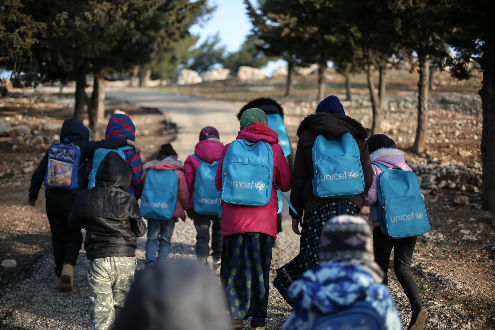 Children walking together with school backpacks